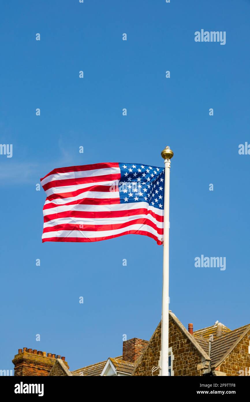 United States of America Stars and Stripes flag flying at the war Memorial. Hunstanton, Norfolk, England. Stock Photo