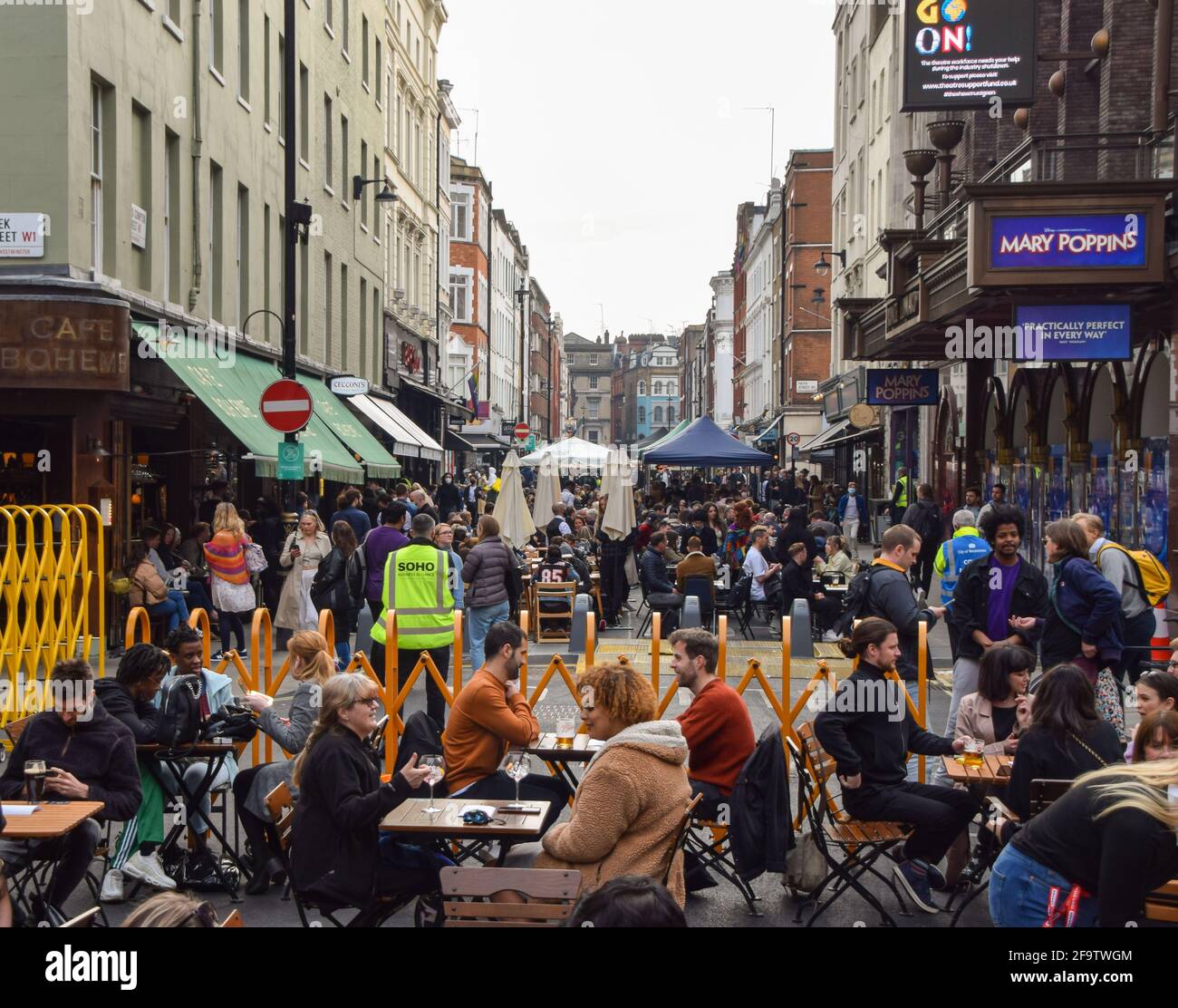 Busy restaurants and bars in Old Compton Street, Soho.Several streets ...