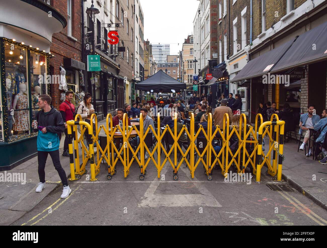 London, UK. 20th Apr, 2021. Busy restaurants and bars seen in Bateman Street, Soho.Several streets in Central London have been blocked for traffic at certain times of the day to allow outdoor, al fresco seating at bars and restaurants. Credit: Vuk Valcic/SOPA Images/ZUMA Wire/Alamy Live News Stock Photo