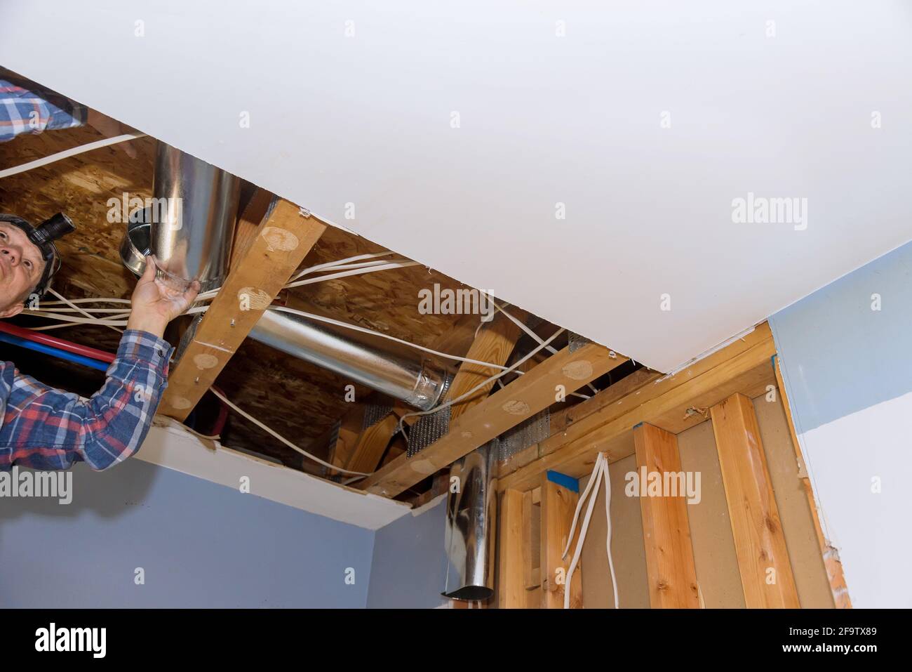 Installation system HVAC duct ventilation pipes in central conditioning a ceiling Stock Photo