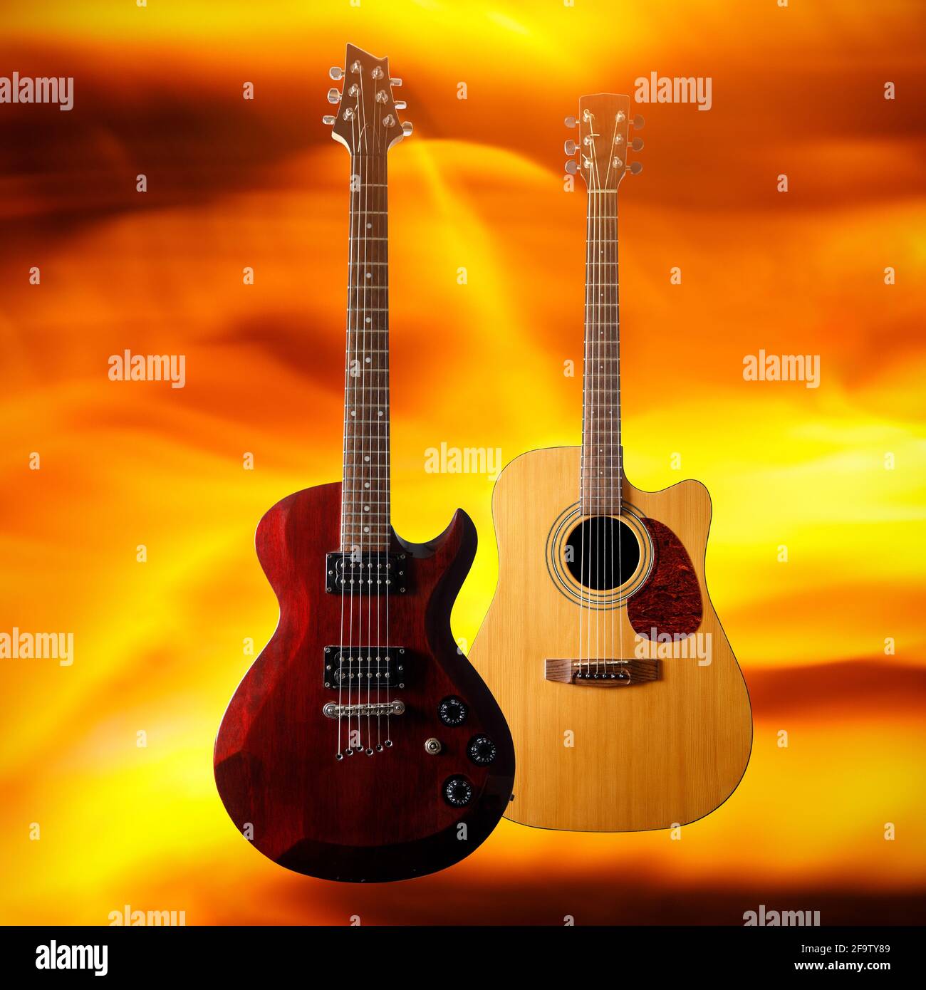 Set of different guitars on a fire flame background Stock Photo