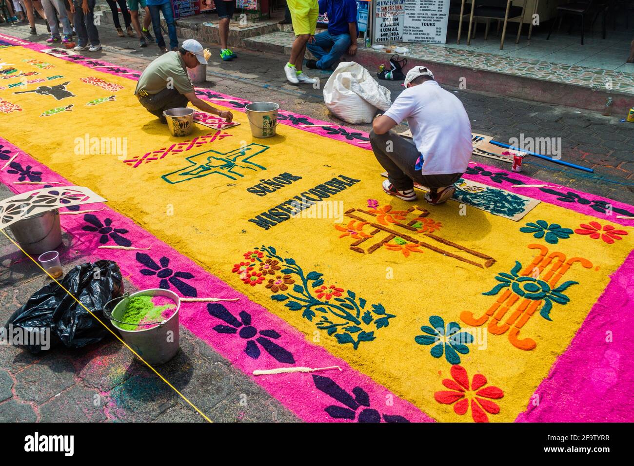 PANAJACHEL, GUATEMALA - MARCH 25, 2016: People decorate Easter carpets in Panajachel village, Guatemala Stock Photo