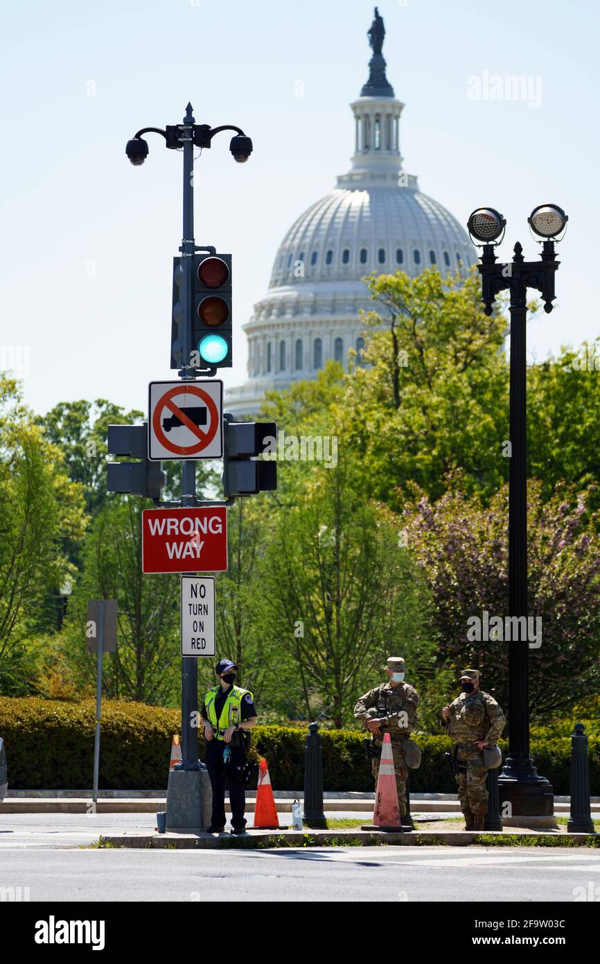 (210420) -- WASHINGTON, April 20, 2021 (Xinhua) -- U.S. National Guard members and a police officer stand guard near the U.S. Capitol in Washington, DC, the United States, on April 20, 2021. Former Minneapolis police officer Derek Chauvin was found guilty of two counts of murder and one count of manslaughter over the death of George Floyd, the judge presiding over the high-profile trial announced Tuesday, reading the jury's verdict. The District of Columbia National Guard activated approximately 250 personnel in response to potential demonstrations related to the Derek Chauvin trial. (Photo Stock Photo