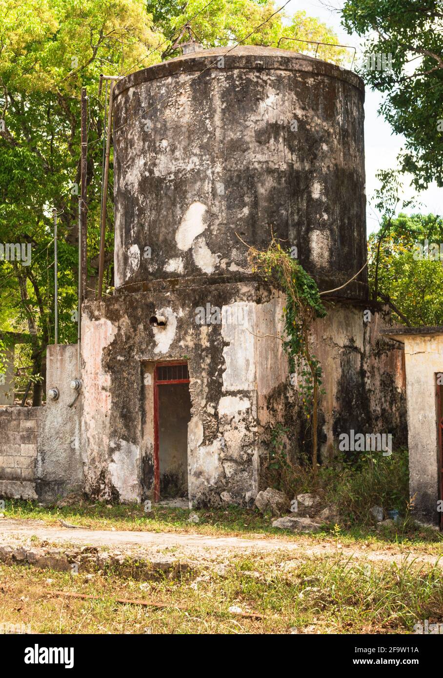 Old water tank tower at former train station in Tunkas, Yucatan, Mexico Stock Photo