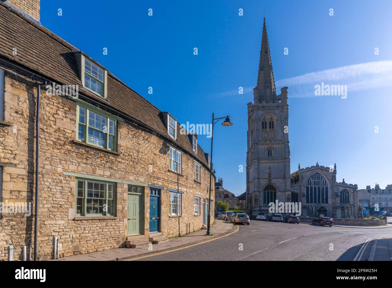 View of All Saints Church and cottages, Stamford, South Kesteven, Lincolnshire, England, United Kingdom, Europe Stock Photo