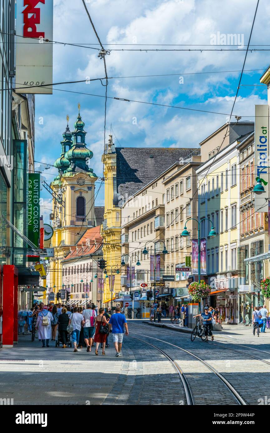 LINZ, AUSTRIA, JULY 30, 2016: People are strolling through Landstrasse street in the Austrian city Linz. Stock Photo
