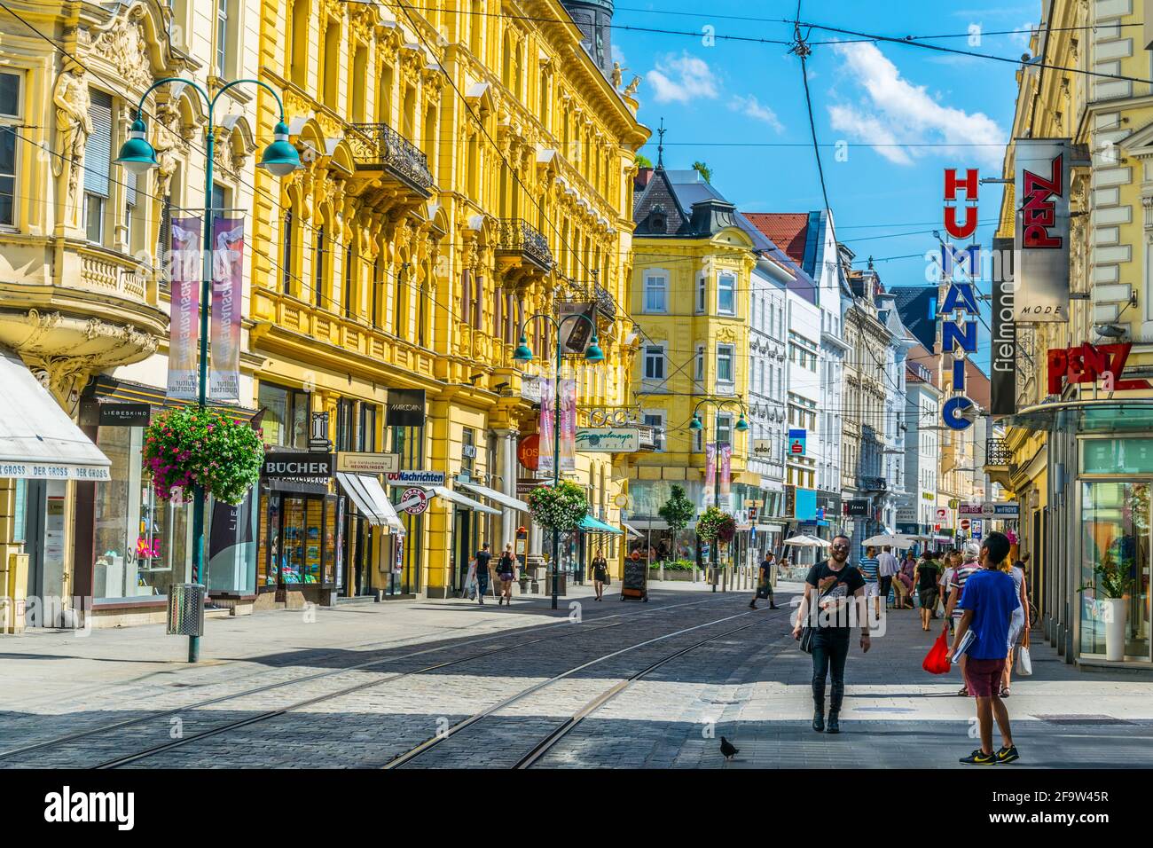 LINZ, AUSTRIA, JULY 30, 2016: People are strolling through Landstrasse street in the Austrian city Linz. Stock Photo