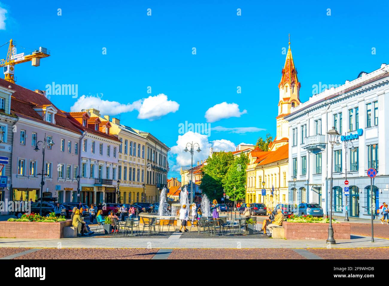 VILNIUS, LITHUANIA, AUGUST 14, 2016: People are strolling through Rotuses aikste - the town hall square of the lithuanian capital Vilnius, Lithuania Stock Photo