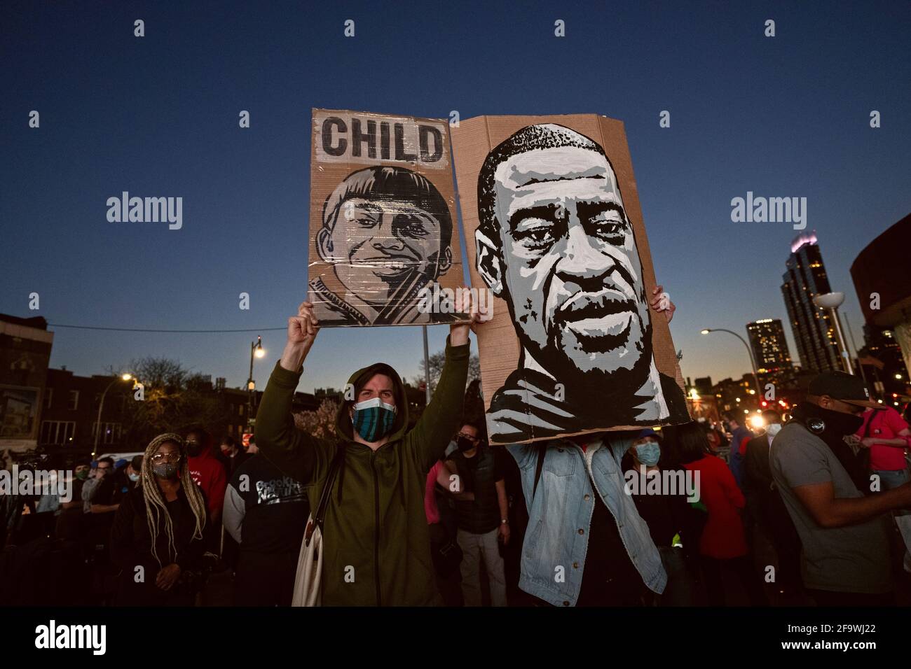 Brooklyn, New York, USA 20 Apr 2021. During rally at Barclays Center following the murder conviction of former Minneapolis police officer Derek Chauvin, protesters hold signs depicting 13-year-old Adam  Toledo, who was shot and killed by Chicago police, and George Floyd, who was killed by Chauvinr. Stock Photo