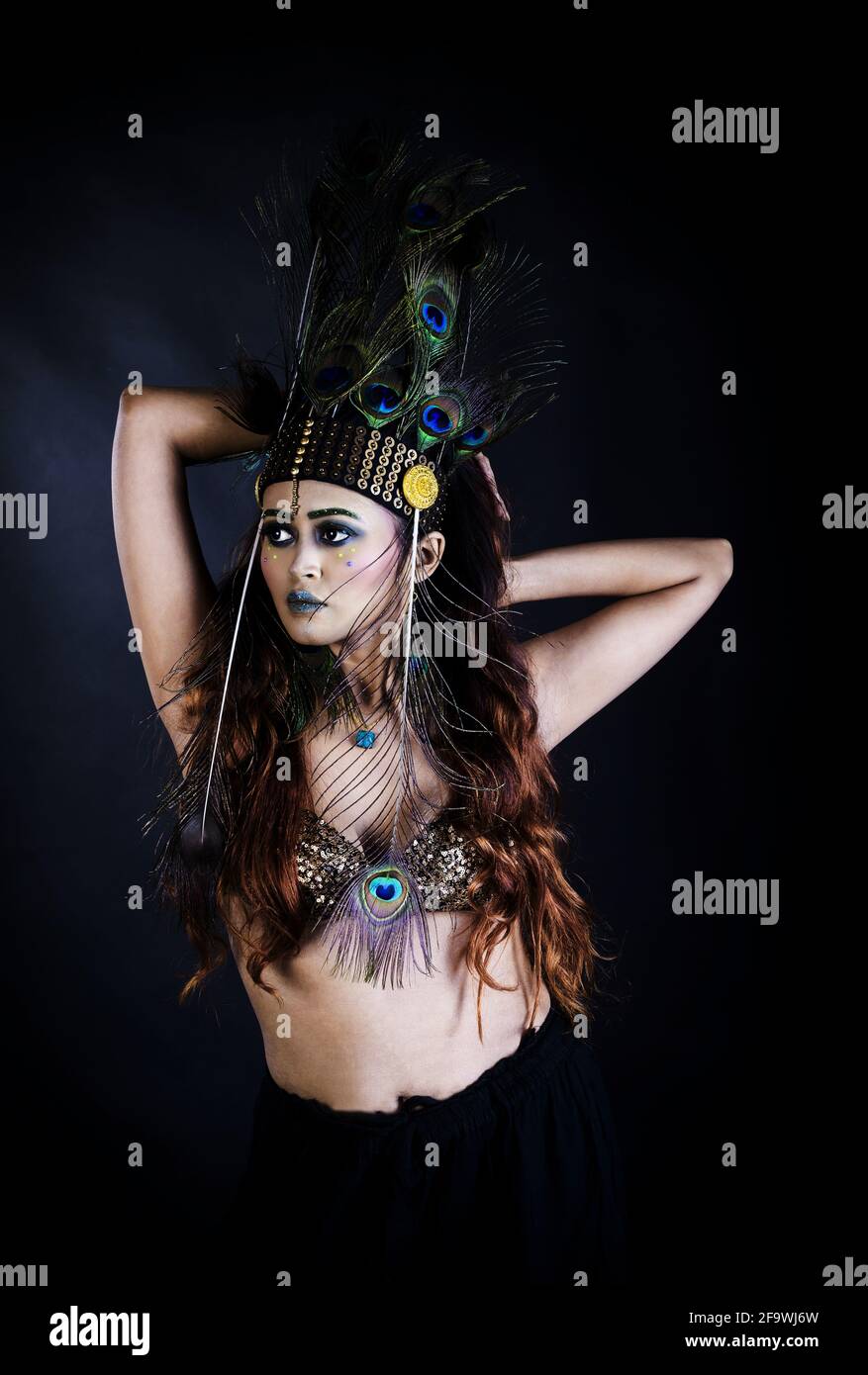 Asian indian girl applying lipstick hires stock photography and images