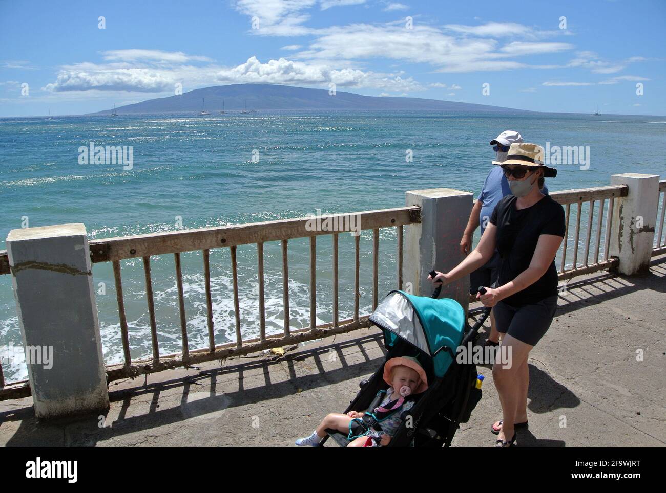 hawaii tourists enjoy the  pacific ocean views  from Kaanapali beach in the small  historic town of Lahaina Maui usa Stock Photo