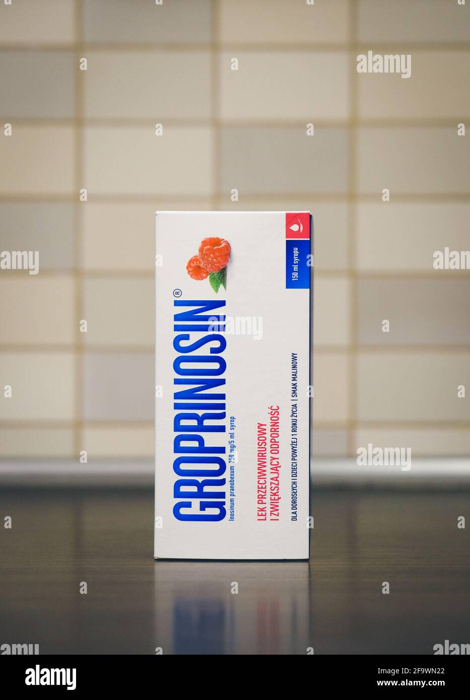 POZNAN, POLAND - Oct 28, 2016: Groprinosin syrup medicine in a box standing  on wooden table Stock Photo - Alamy