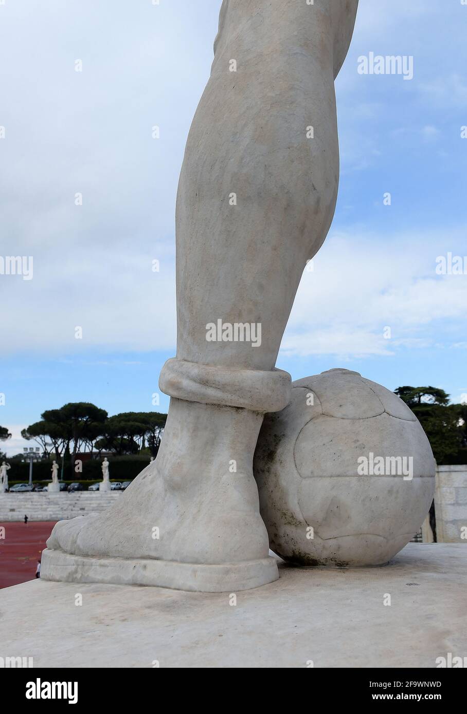 Marble statue of a footballer in the Stadium of the marbles (Stadio dei Marmi) in the Foro Italico, a sport complex in Rome, Italy on April 20, 2021. This stadium was inaugurated in 1932 by Benito Mussolini. It has Carrara marble steps lined by 64 marble statues of athletes in classical style. European football has been plunged into unprecedented crisis and division with the announcement of a much-dreaded breakaway Super League. Photo by Eric Vandeville/ABACAPRESS.COM Stock Photo