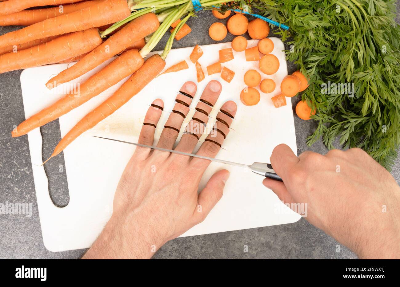 Cutting fingers with a knife Concept of clumsiness Stock Photo Alamy