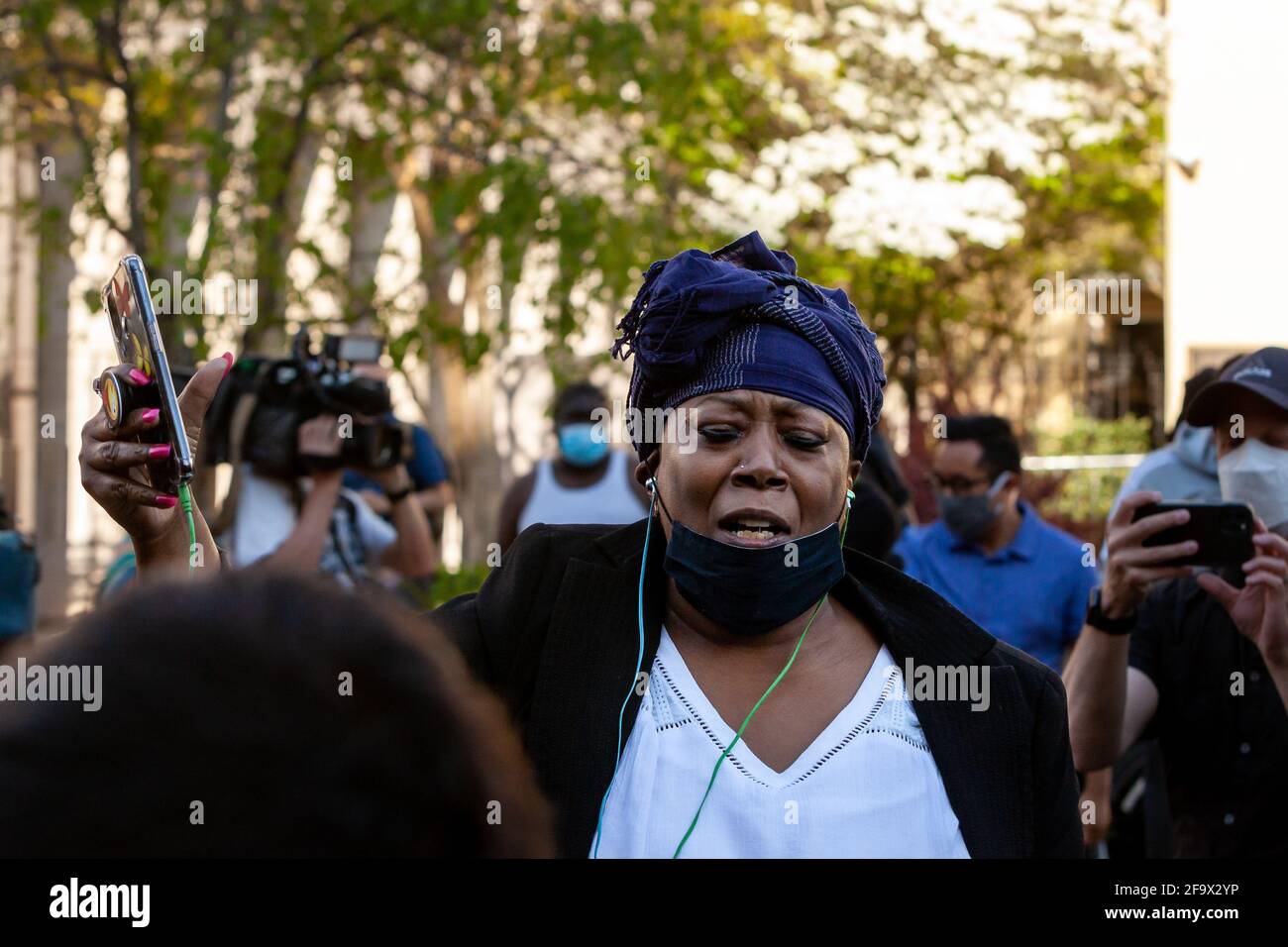 Washington, DC, USA, 20 April, 2021.  Pictured: Lisa Robinson of Washington, DC, celebrates the conviction of former police officer Derek Chauvin for the murder of George Floyd immediately after the verdict is announced.  Credit: Allison C Bailey/Alamy Live News Stock Photo