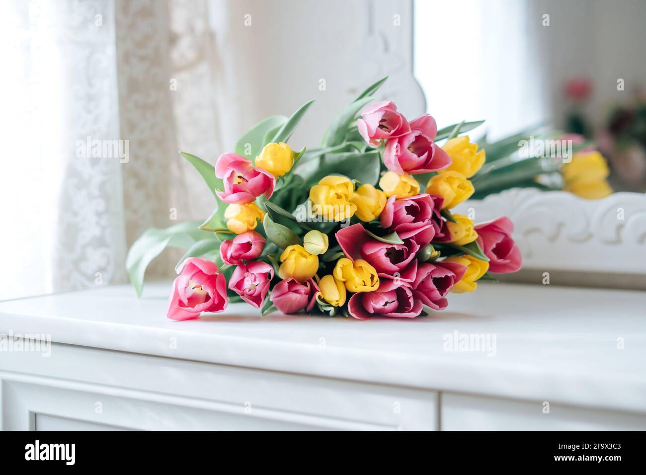 Yellow and pink tulips bouquet Stock Photo - Alamy