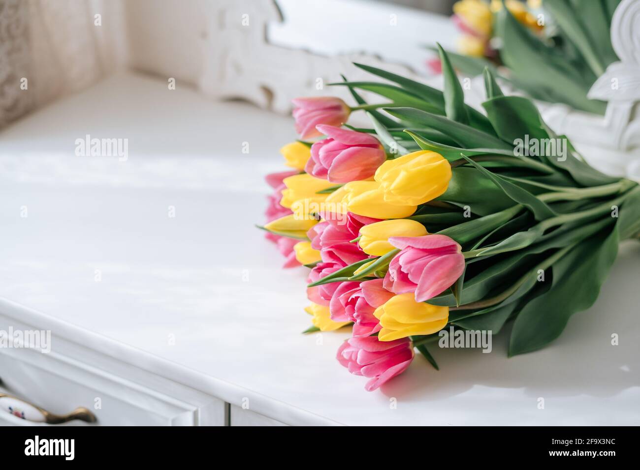 Yellow and pink tulips bouquet Stock Photo