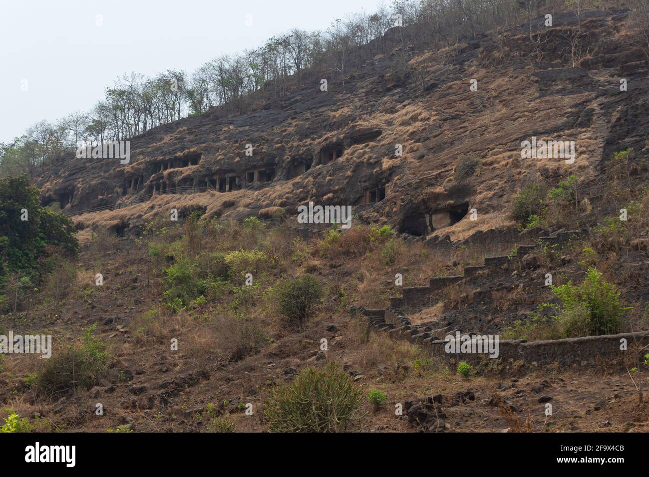 Outside view of Gandharpale Buddhist caves. Group of 30 Buddhist caves, 105 km south of Mumbai, near Mahad, Maharashtra, India Stock Photo