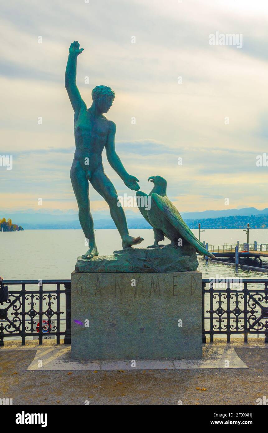ZURICH, SWITZERLAND, OCTOBER 24, 2015: People are admiring zurich lake from the viewpoint with famous ganimede statue Stock Photo