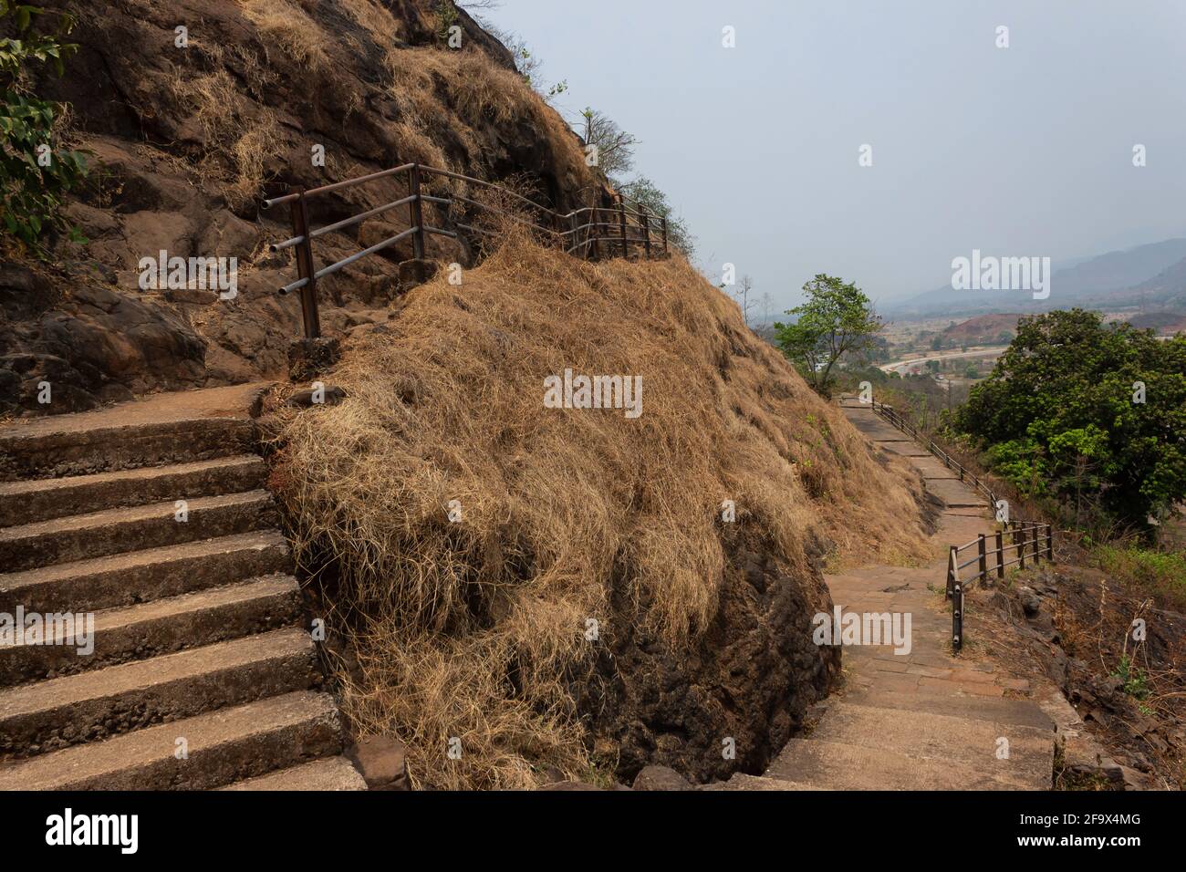 Steps for the second floor of caves, Gandharpale Buddhist caves. Group of 30 Buddhist caves, 105 km south of Mumbai, near Mahad, Maharashtra, India Stock Photo