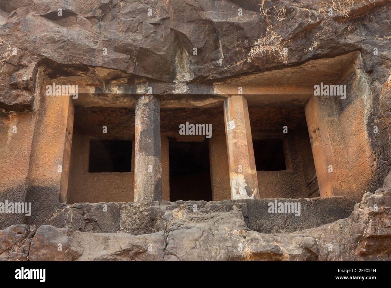 Façade of Cave No 27, Gandharpale Buddhist caves. Group of 30 Buddhist caves, 105 km south of Mumbai, near Mahad, Maharashtra, India Stock Photo