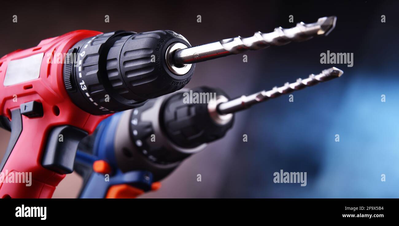 Composition with two cordless drills also working as screw guns Stock Photo