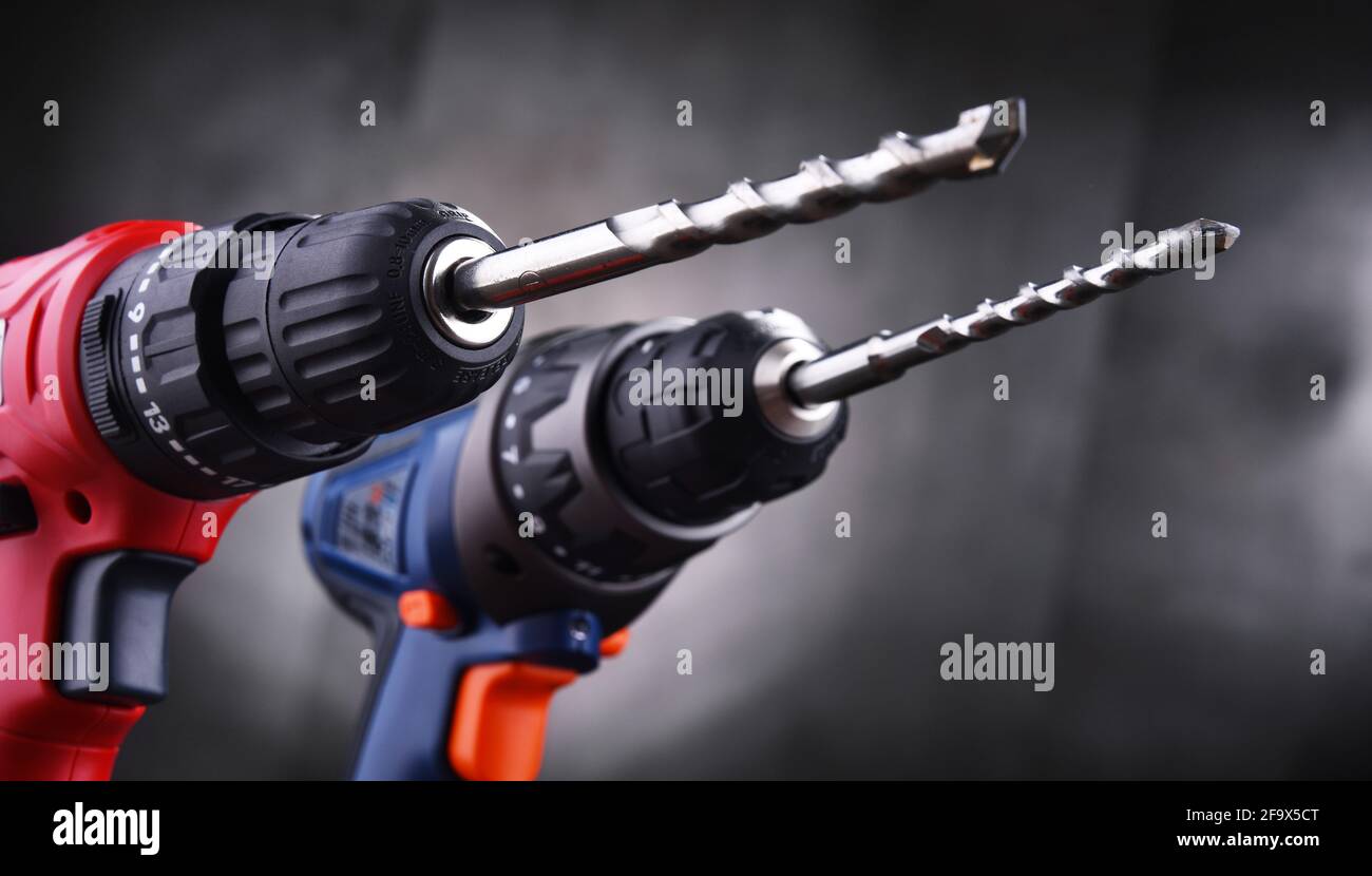 Composition with two cordless drills also working as screw guns Stock Photo