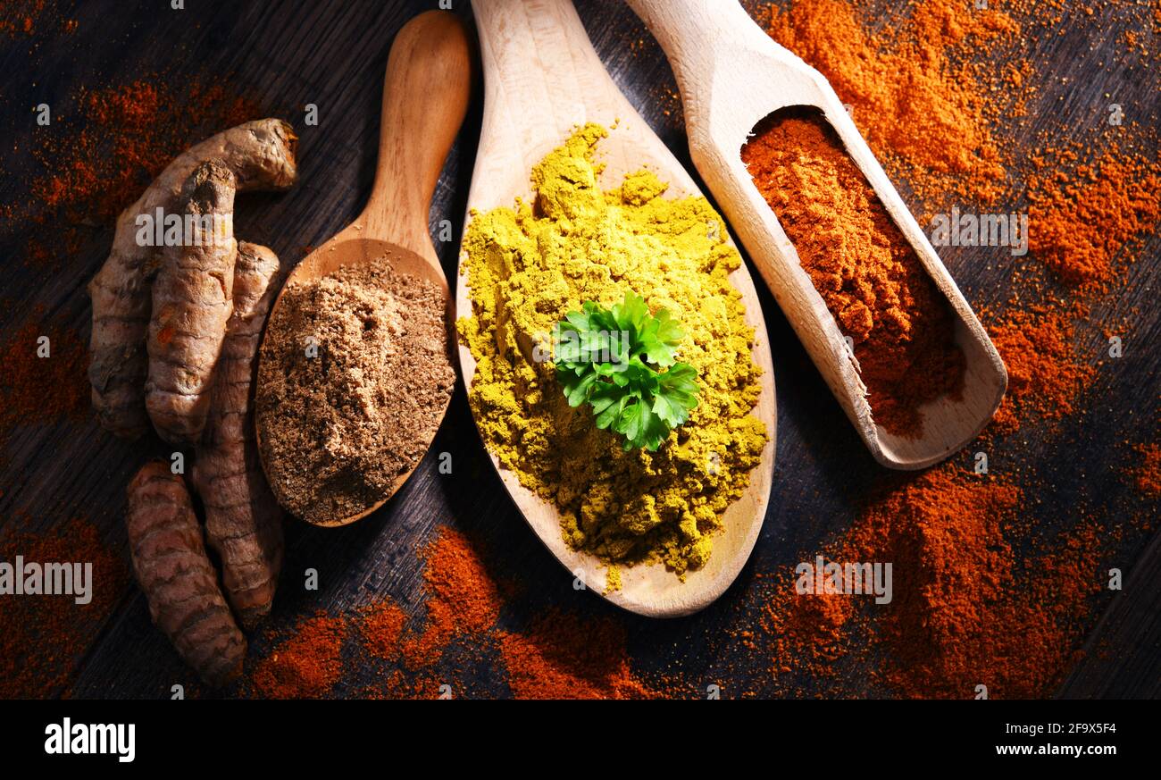 Composition with spices on wooden kitchen table. Stock Photo