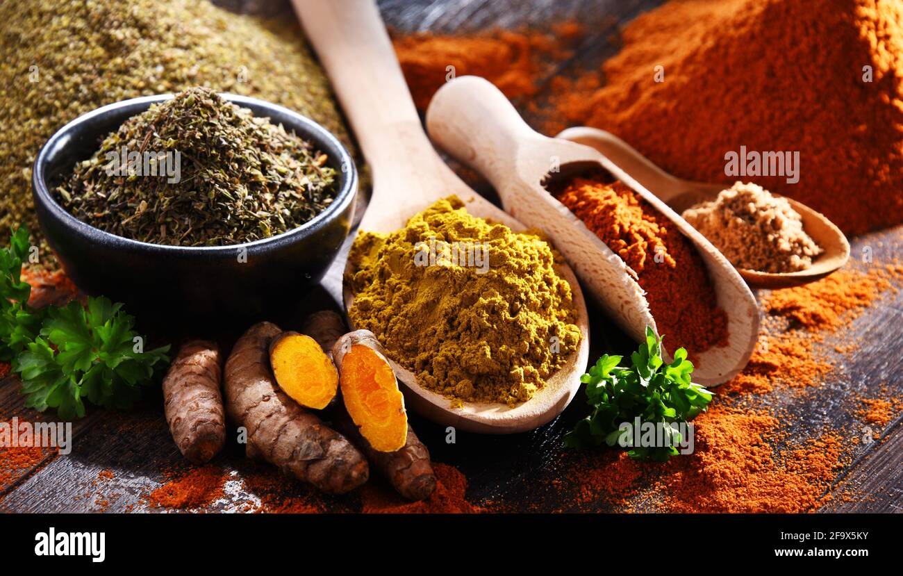 Composition with spices on wooden kitchen table. Stock Photo