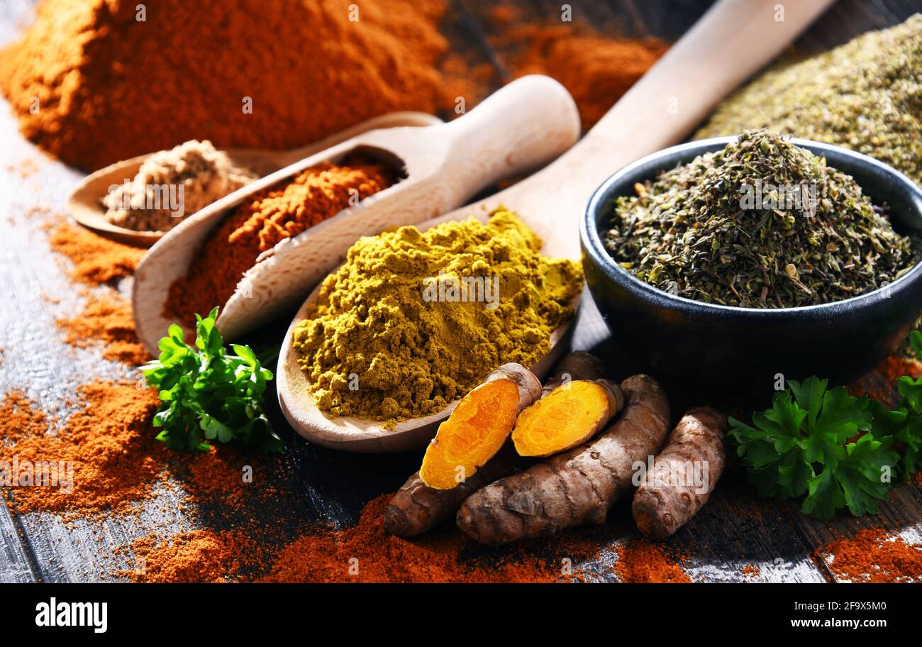 Composition with spices on wooden kitchen table. Stock Photo