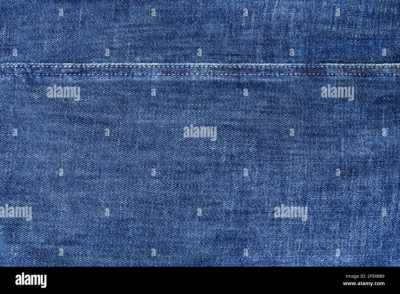 Blue jeans texture and seam closeup, thread stitch line, jean textile ...