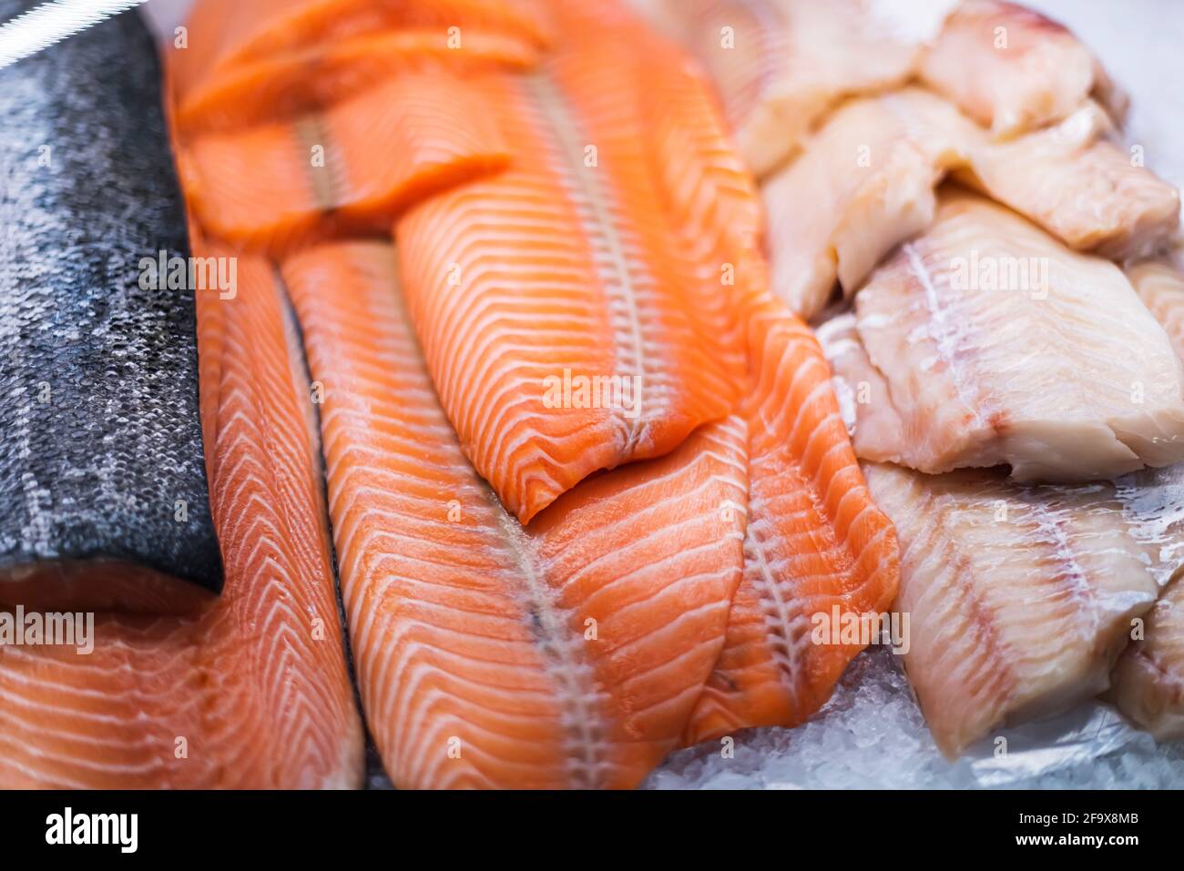 Fresh fish fillet put up for sale in a supermarket refrigerator Stock