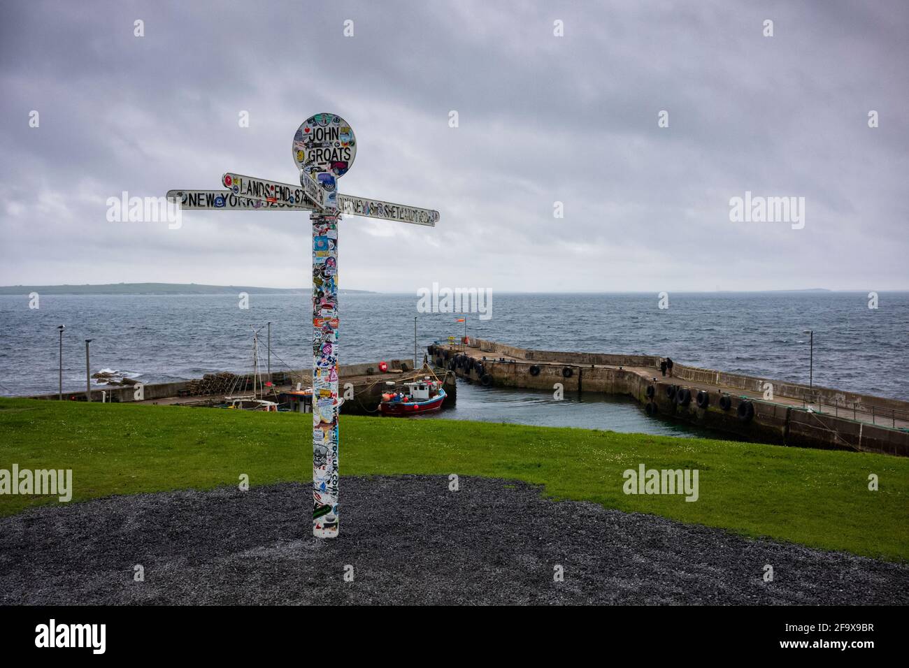 John O'Groats, UK - June 24, 2019: The landmark "Journey's End" signpost at John o' Groats, a popular tourist attraction marking the furthest north on Stock Photo