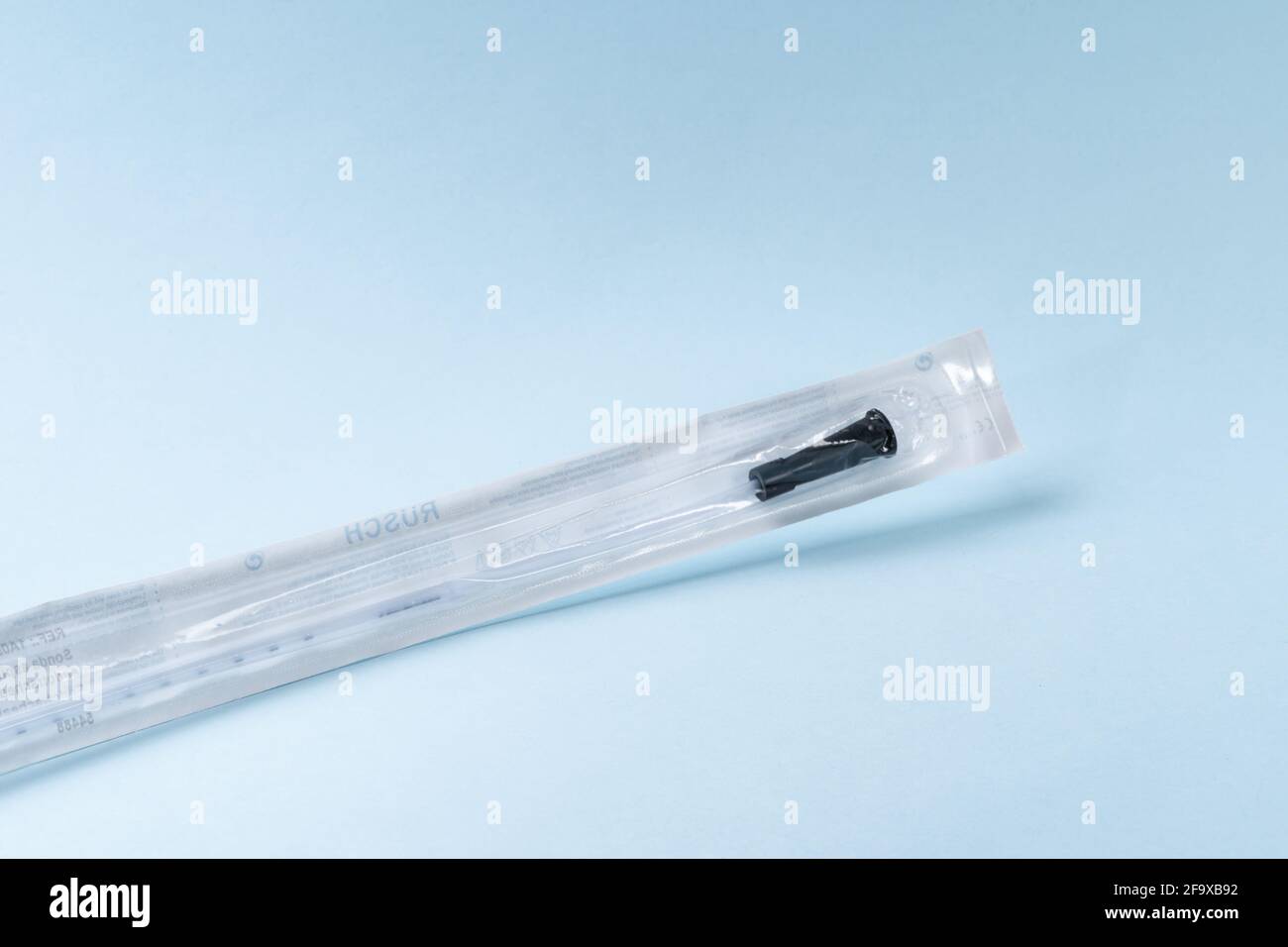 Rusch male and female all purpose catheter on blue background, straight