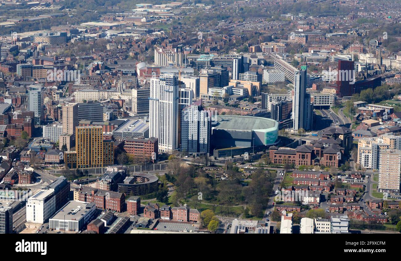 An aerial view of Leeds City Centre, West Yorkshire, Northern England, UK showing new student accommodation towers dwarfing the arena Stock Photo