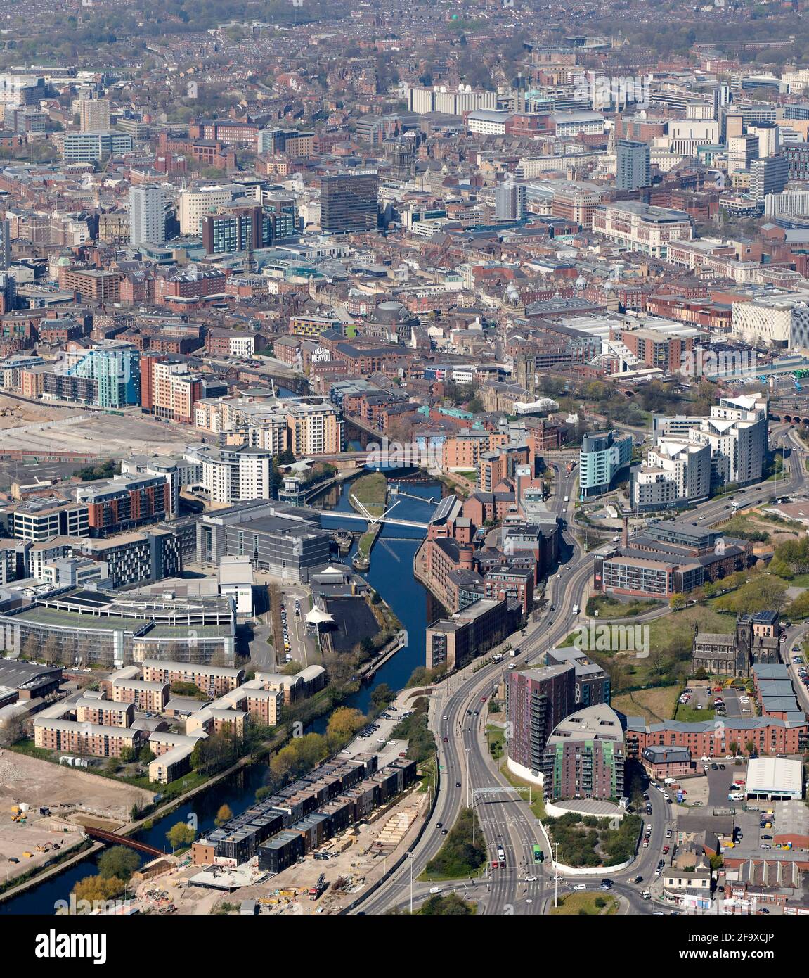 An aerial view of Leeds City Centre, West Yorkshire, Northern England, UK, from the east looking up the River Aire showing new riverside development Stock Photo