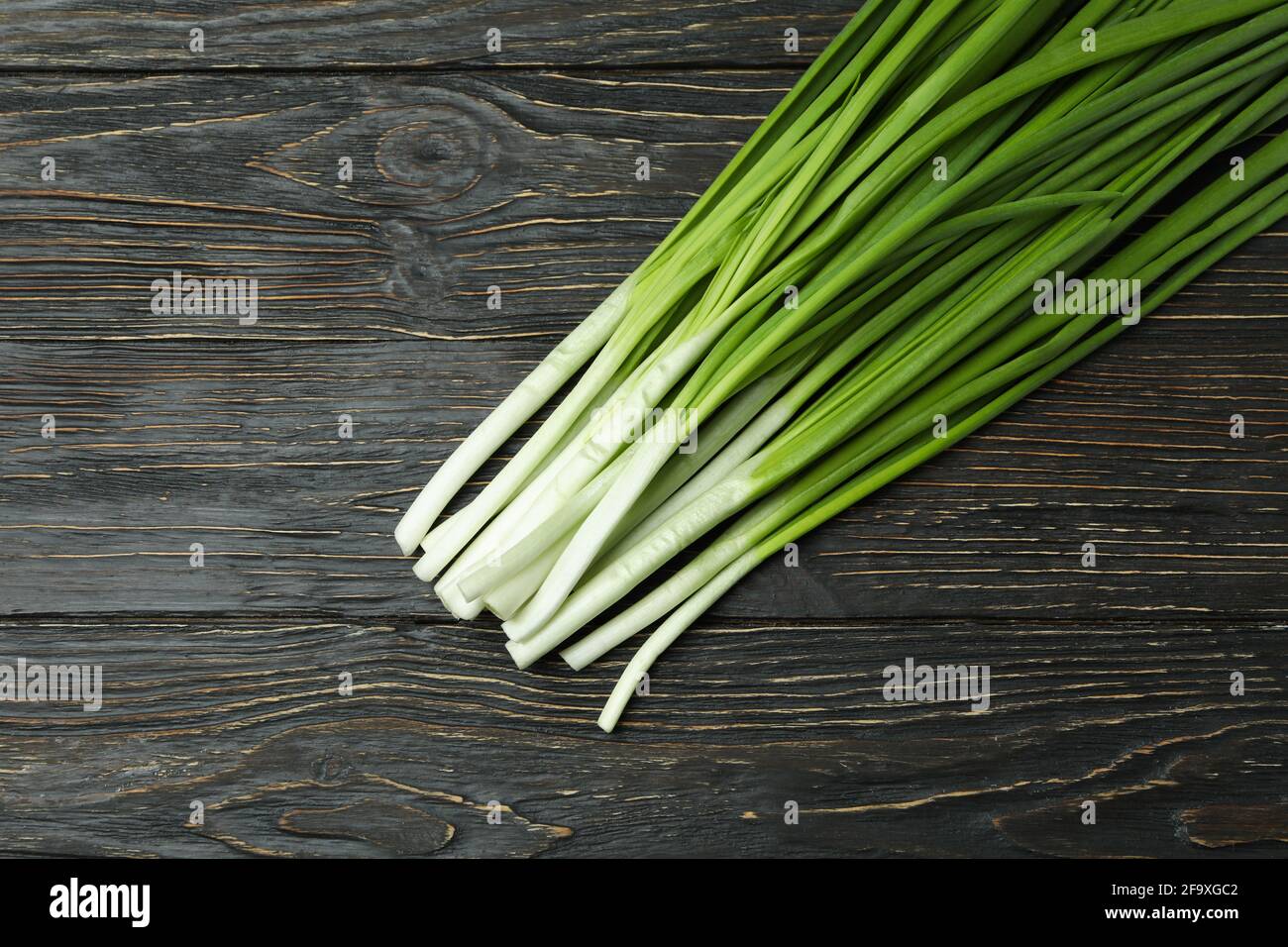 Fresh green onion on wooden table, space for text Stock Photo - Alamy