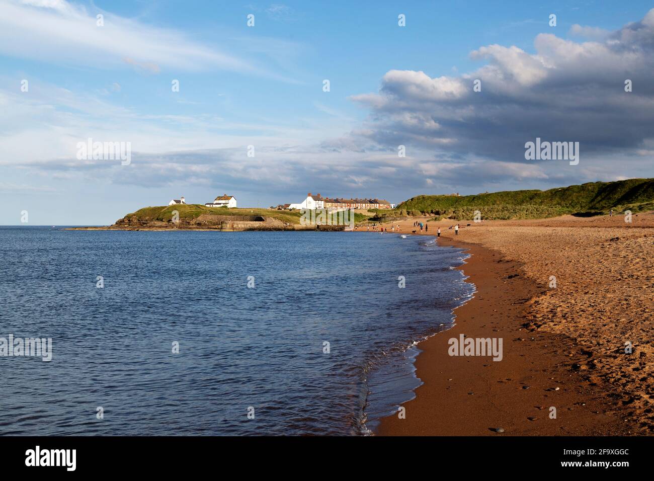 The North Sea coast at Seaton Sluice in Northumberland, England. The sea is calm. Stock Photo