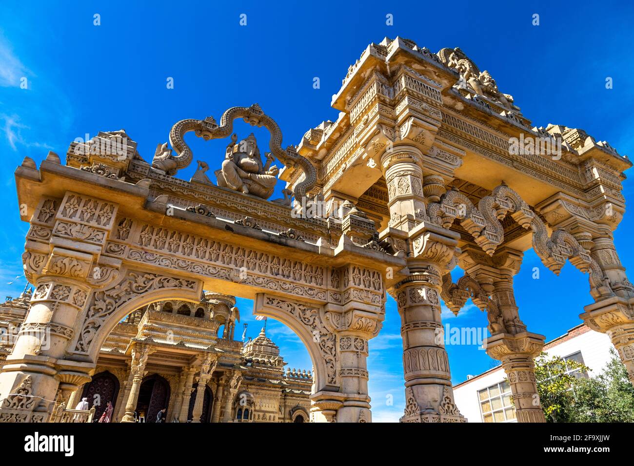 Ornate limestone Hindu temple Shri Vallabh Nidhi Mandir in Alperton, Wembley, London, UK Stock Photo