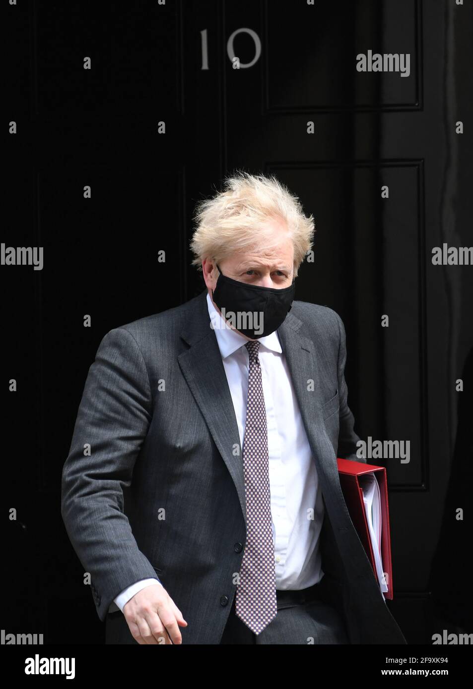 Prime Minister Boris Johnson leaves 10 Downing Street to attend Prime Minister's Questions at the Houses of Parliament in London. Picture date: Wednesday April 21, 2021. Stock Photo