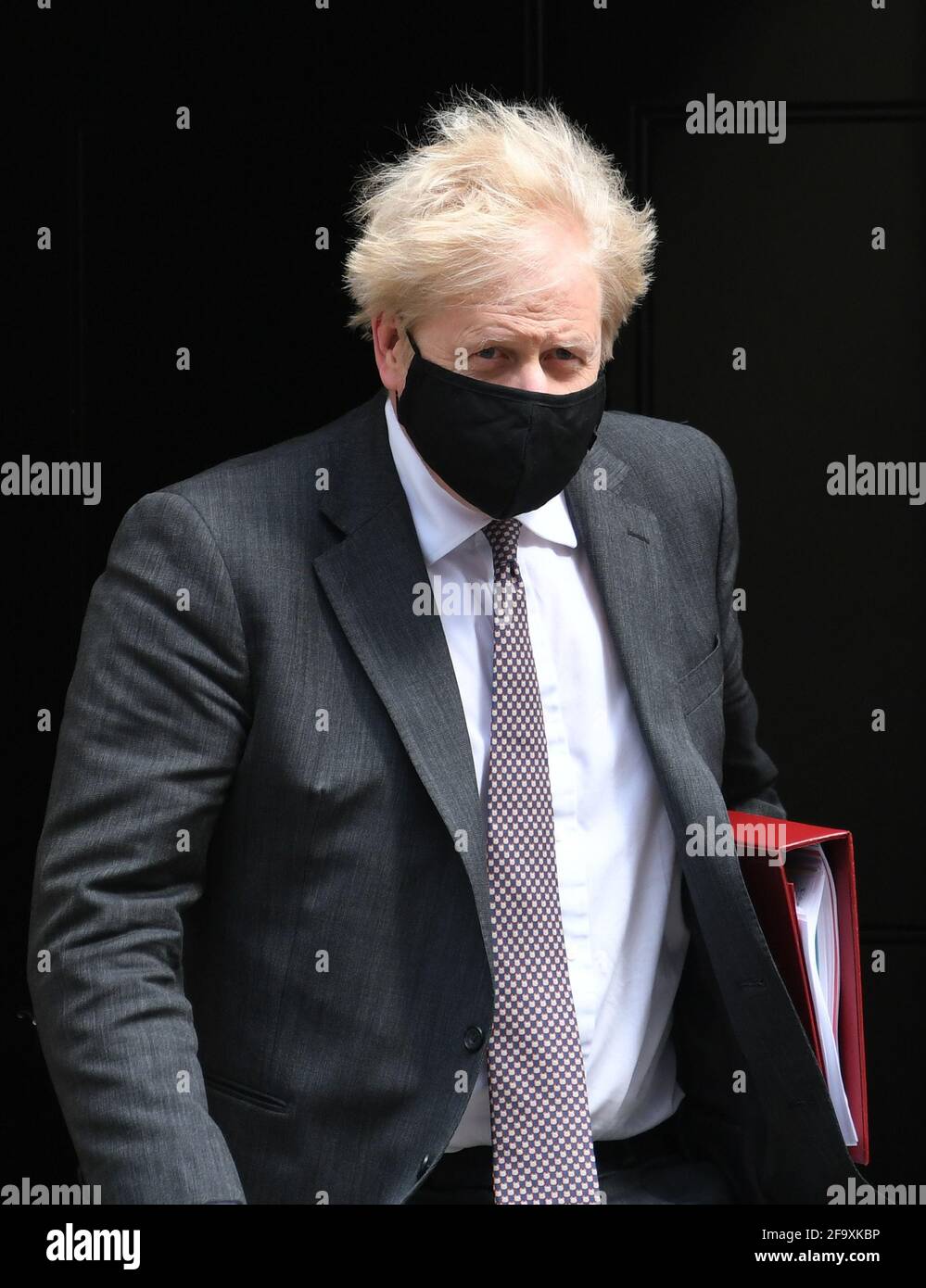 Prime Minister Boris Johnson leaves 10 Downing Street to attend Prime Minister's Questions at the Houses of Parliament in London. Picture date: Wednesday April 21, 2021. Stock Photo