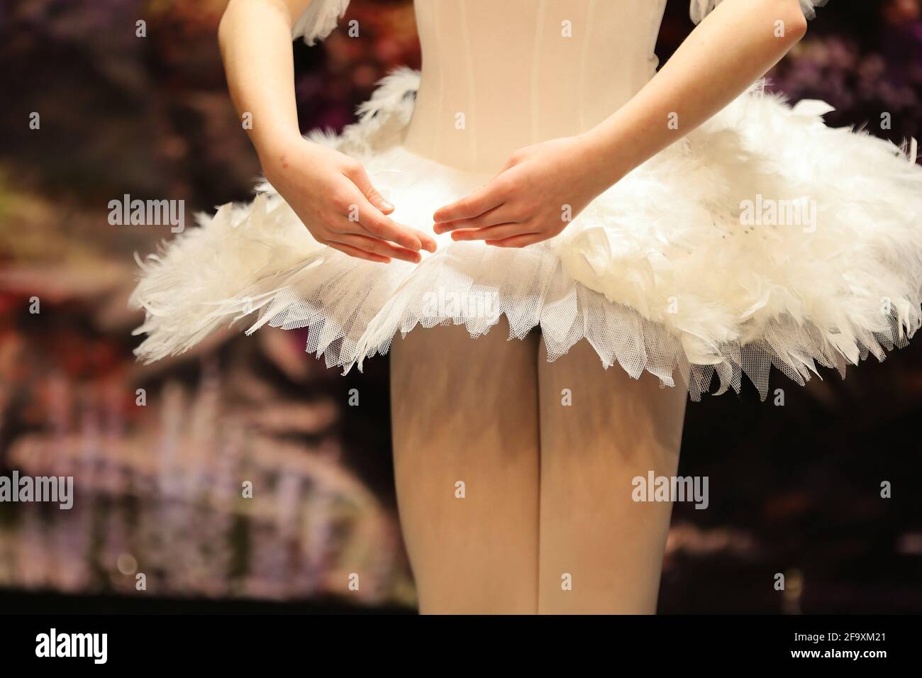ballerina and her hands on the background of the dress Stock Photo
