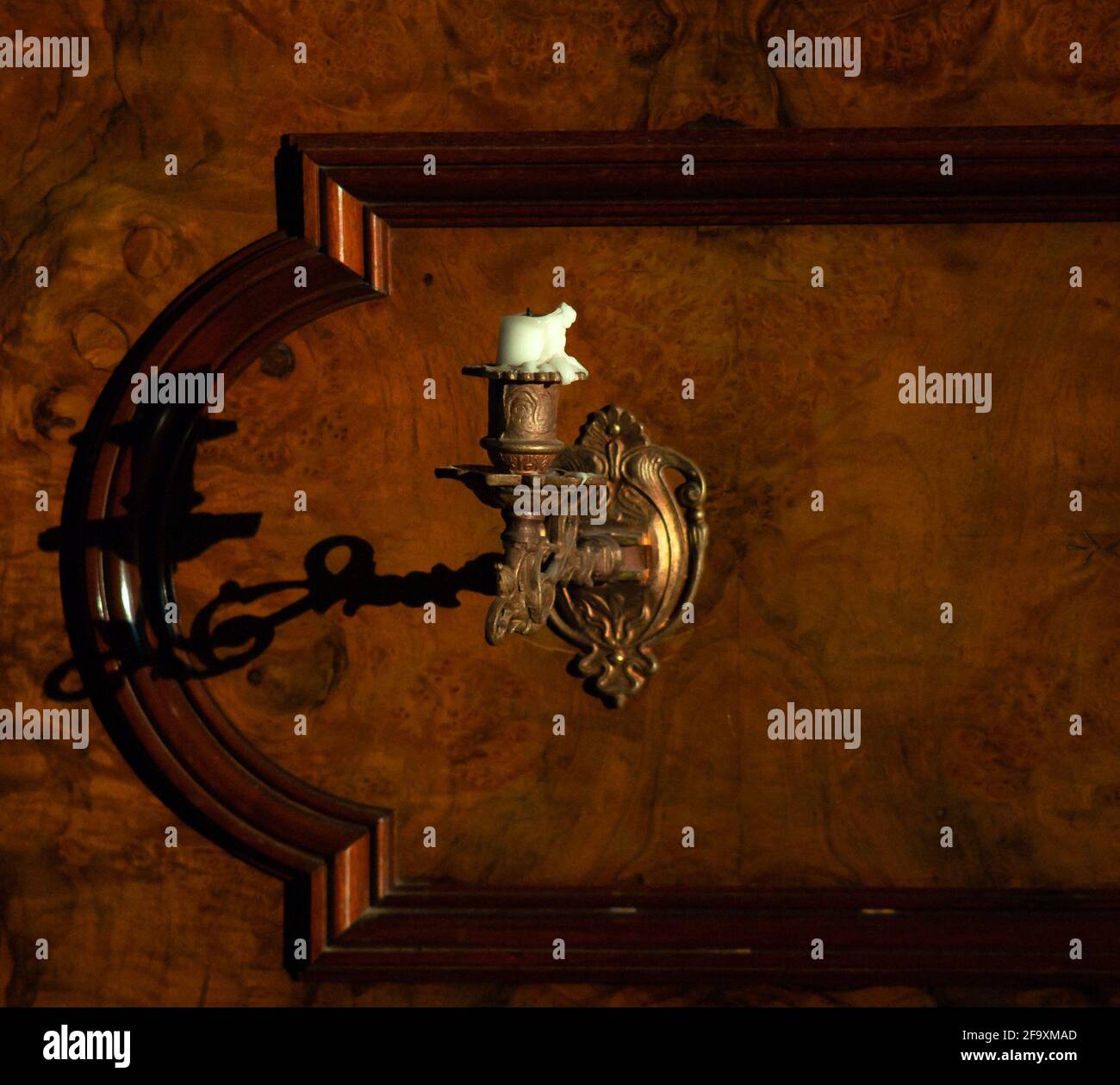 candle on a piano brass candle holder Stock Photo Alamy