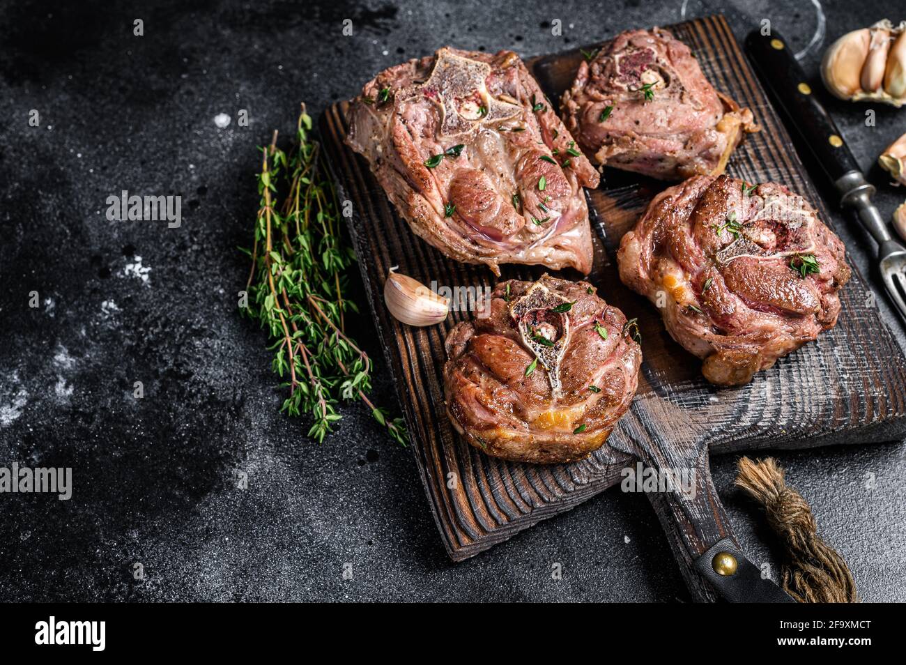 Grilled Lamb Neck Meat Steaks On A Wooden Board With Herbs Black Background Top View Copy Space Stock Photo Alamy
