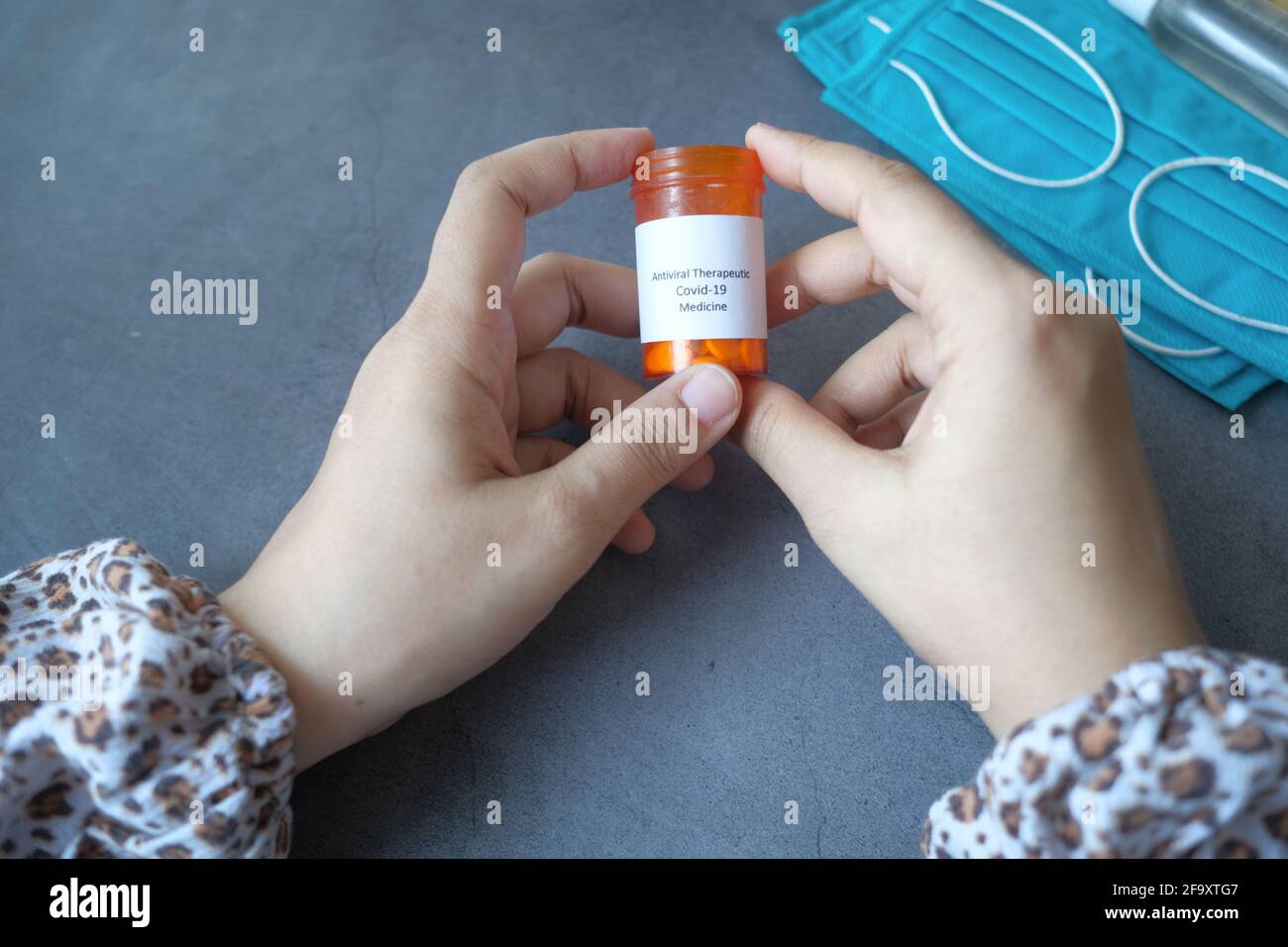 Blue medical masks on table hi-res stock photography and images - Alamy