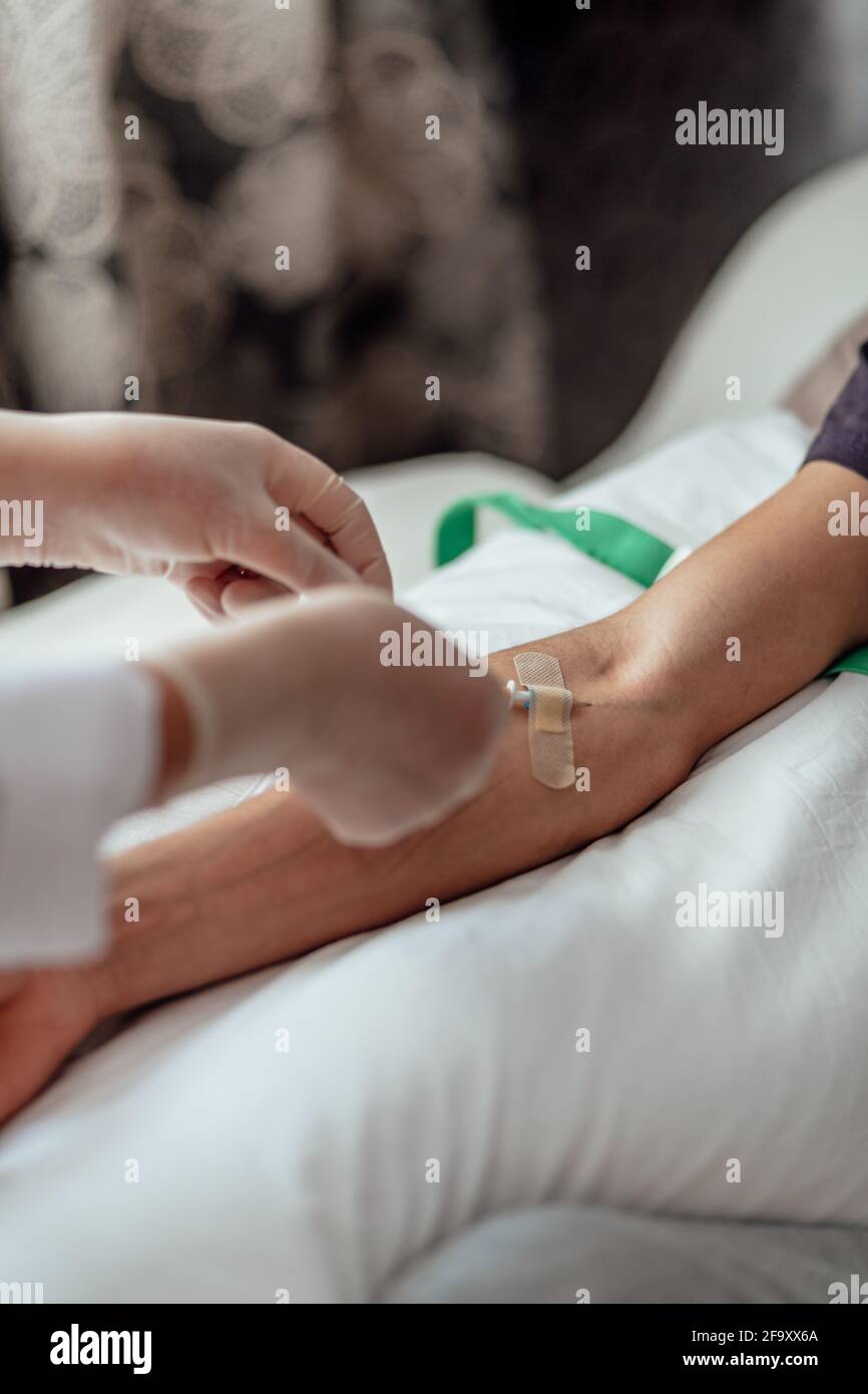 close up of doctor giving an injection to Man, getting vaccinated, coronavirus, covid-19 and vaccination concept. Health care in hospital. Stock Photo