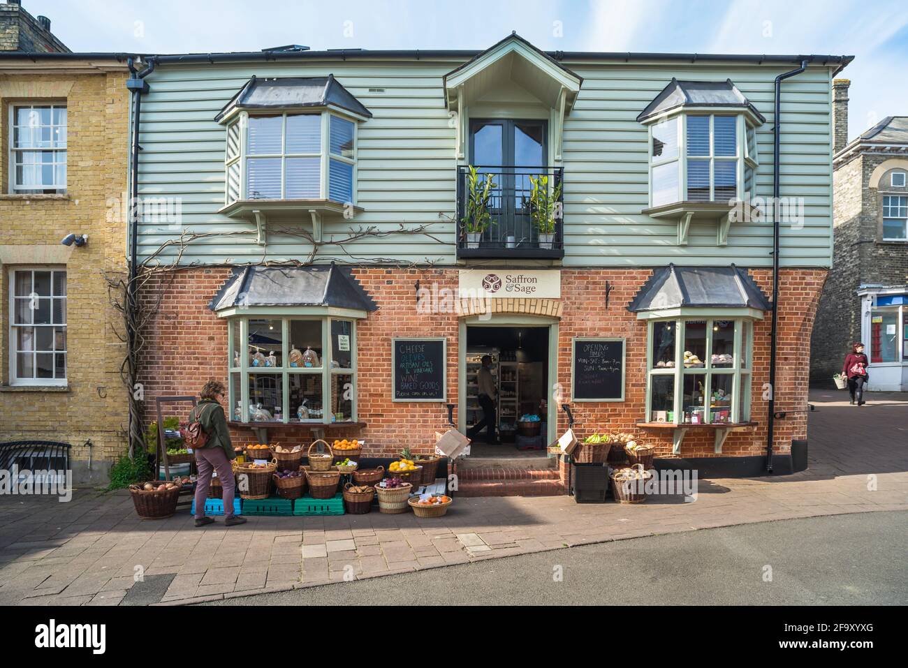 Saffron Walden shop, view of a woman looking at a delicatessen and