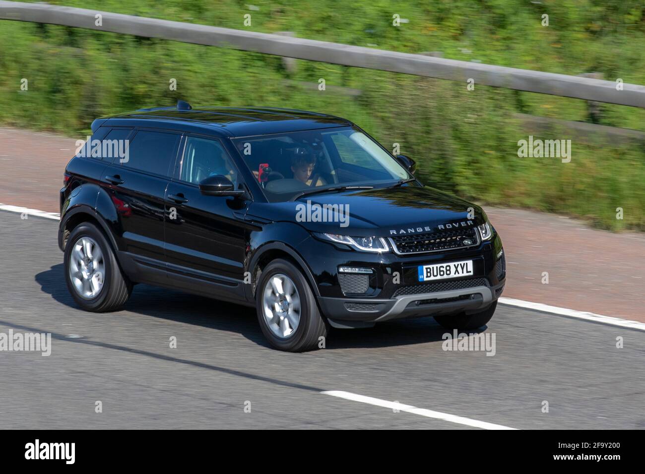 2018 (68) black Land Rover Range Rover Evoque 2.0 eD4 SE Tech SUV 5dr Diesel ; moving vehicles, cars, vehicle driving on UK roads, motors, motoring on the M6 English motorway road network Stock Photo
