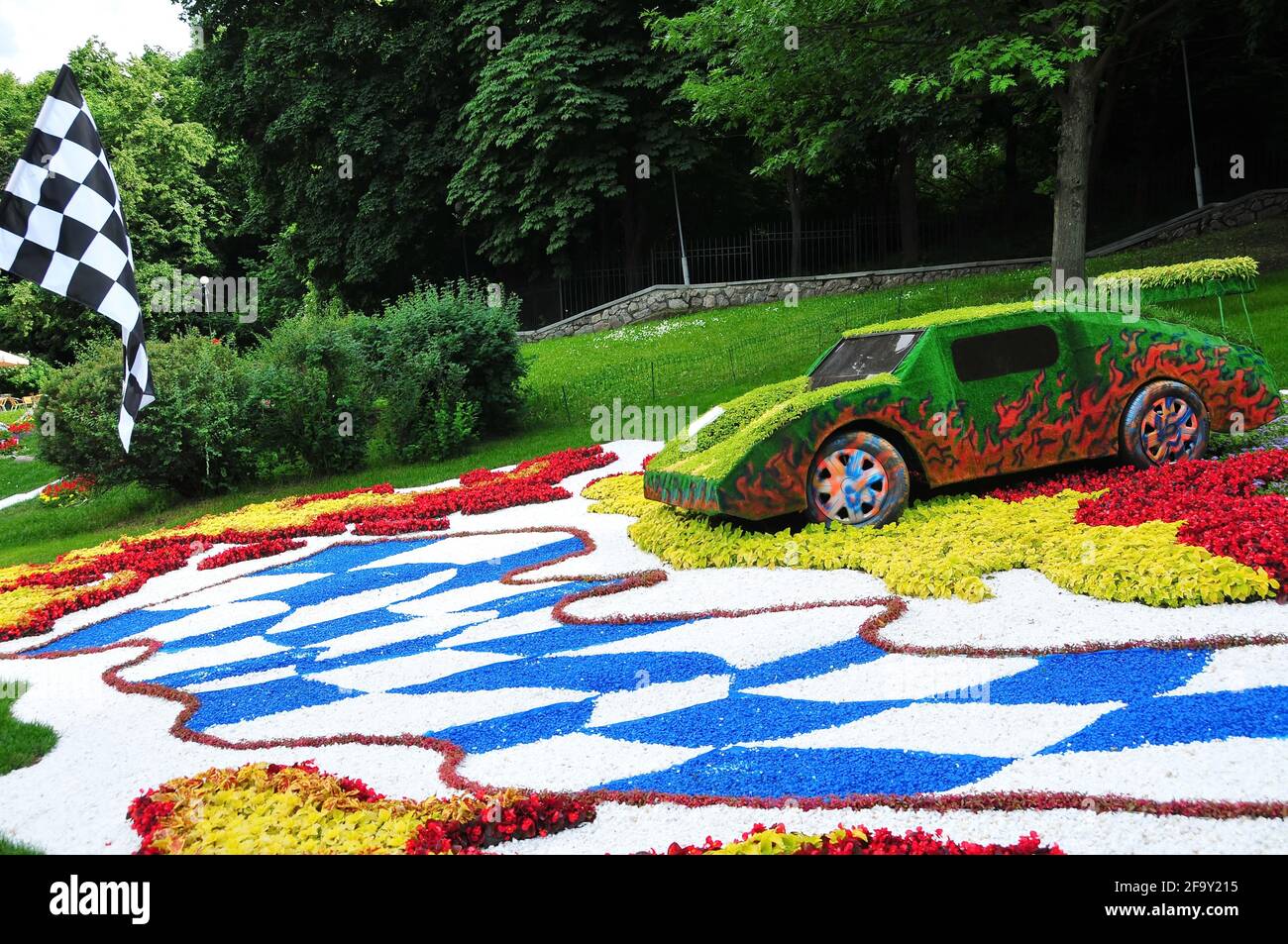 Festival of flowers Landscape design - Cars decorated with flowers on Spyvoche pole park, Kiev, Ukraine Stock Photo
