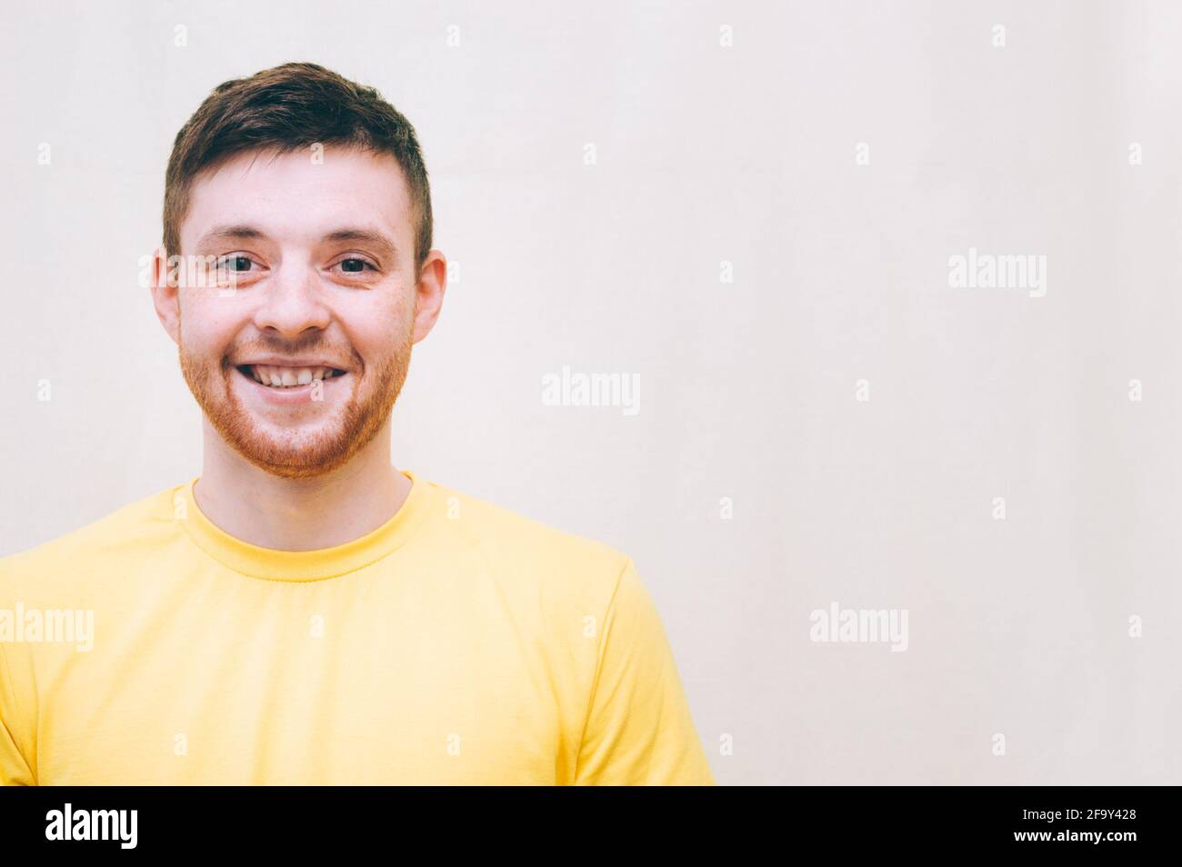 Man in yellow t shirt hi-res stock photography and images - Alamy